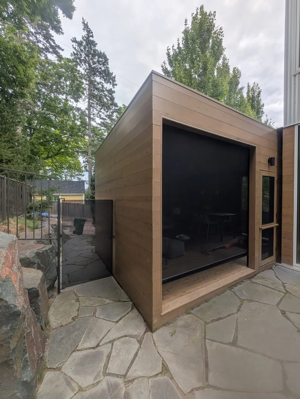 Stained horizontal wood siding on a screen porch in Minneapolis